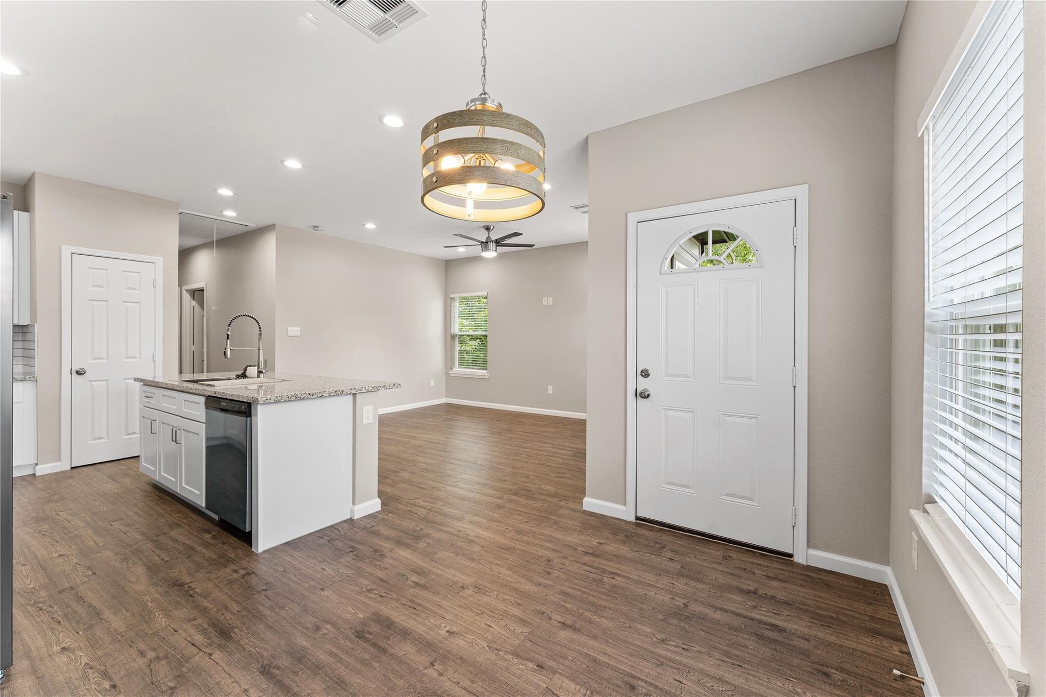 5218 Jezebel Street, Unit B Houston, TX 77033 - Photo 8 of 31 a view of kitchen with cabinets and wooden floor