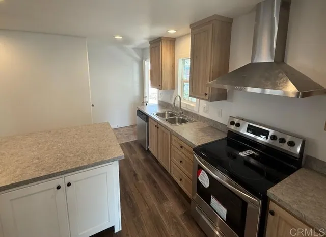 a kitchen with a stove and a sink