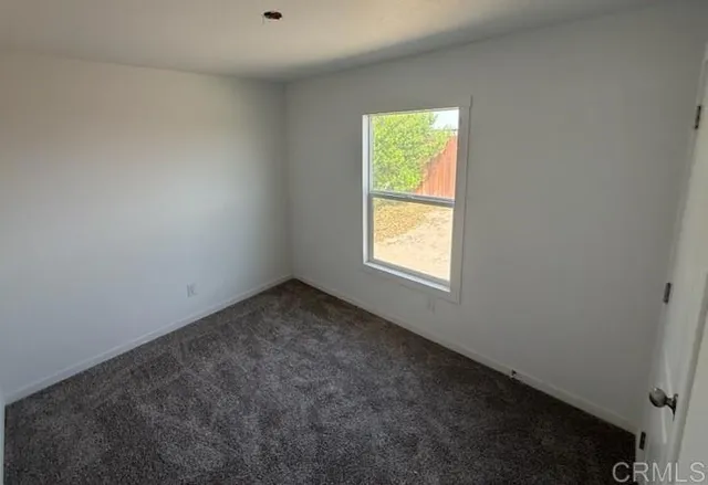 a bathroom with a sink a toilet a mirror and tub