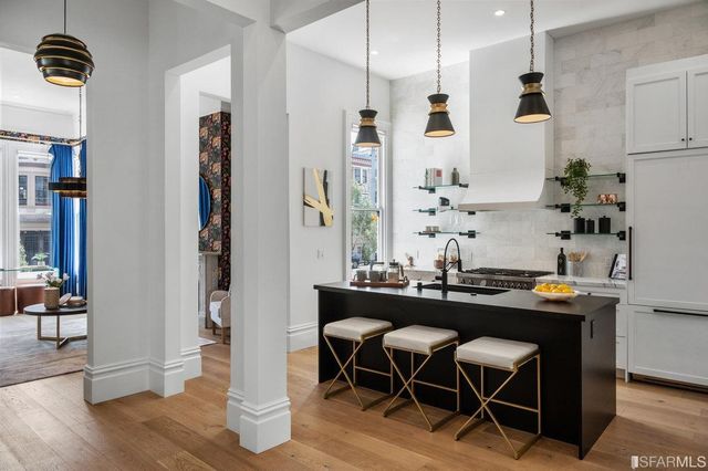 a view of a workspace with furniture and window