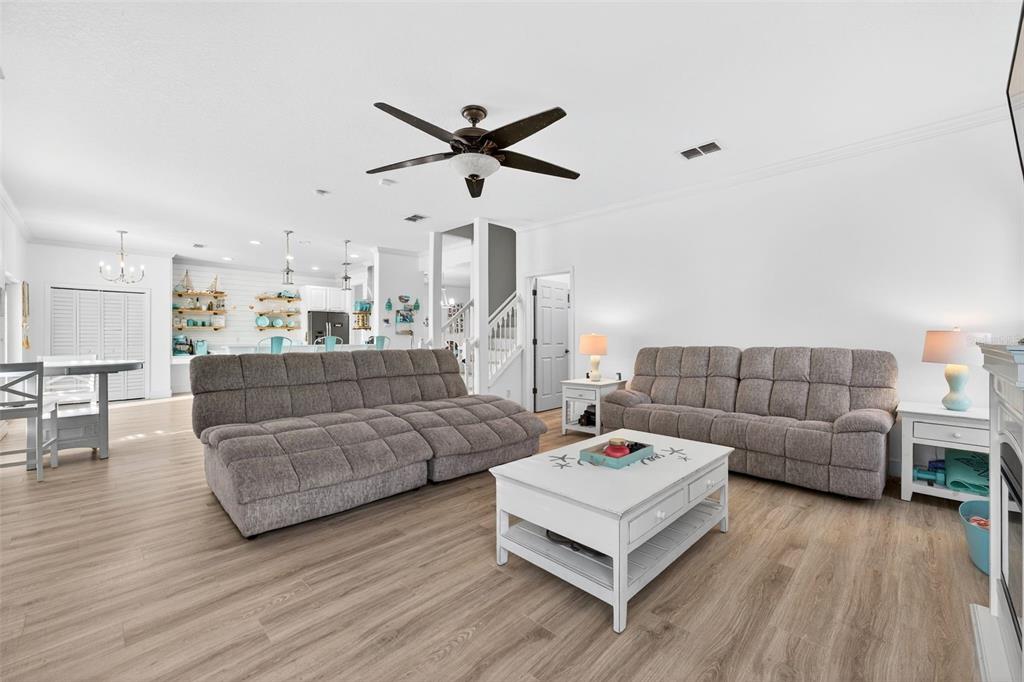 20930 Sullivan Ranch Boulevard Mount Dora, FL 32757 - Photo 15 of 41 a living room with furniture and a wooden floor