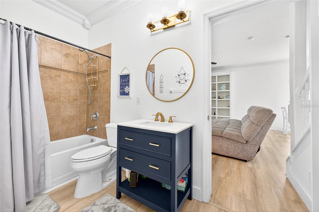 20930 Sullivan Ranch Boulevard Mount Dora, FL 32757 - Photo 17 of 41 a bathroom with a toilet a sink and a mirror