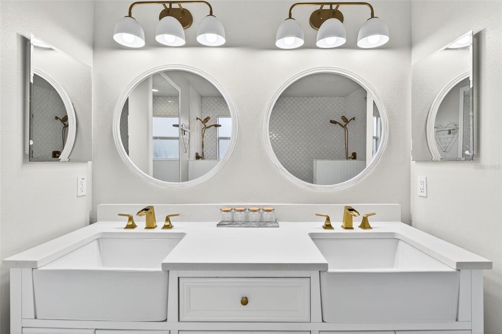 20930 Sullivan Ranch Boulevard Mount Dora, FL 32757 - Photo 23 of 41 a bathroom with a double vanity sink and a mirror