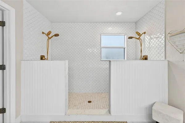 a bathroom with a shower and a sink