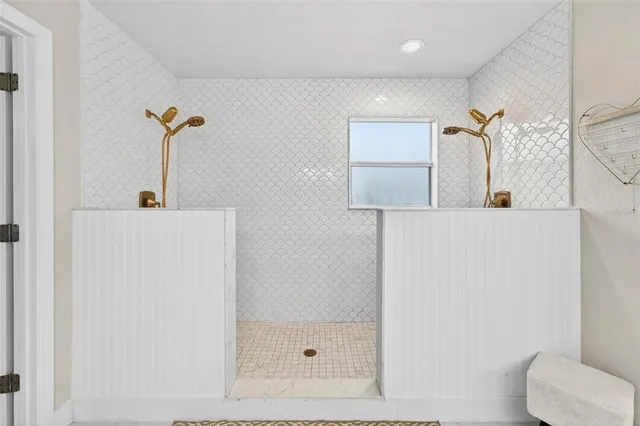 a bathroom with a shower and a sink