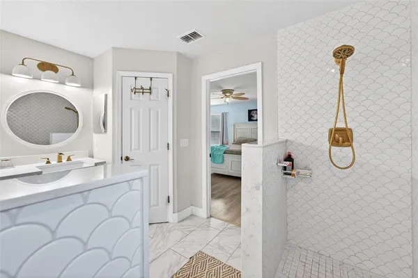 a bathroom with a sink and a mirror