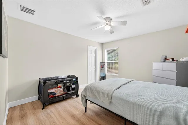 a bedroom with a bed and a tv