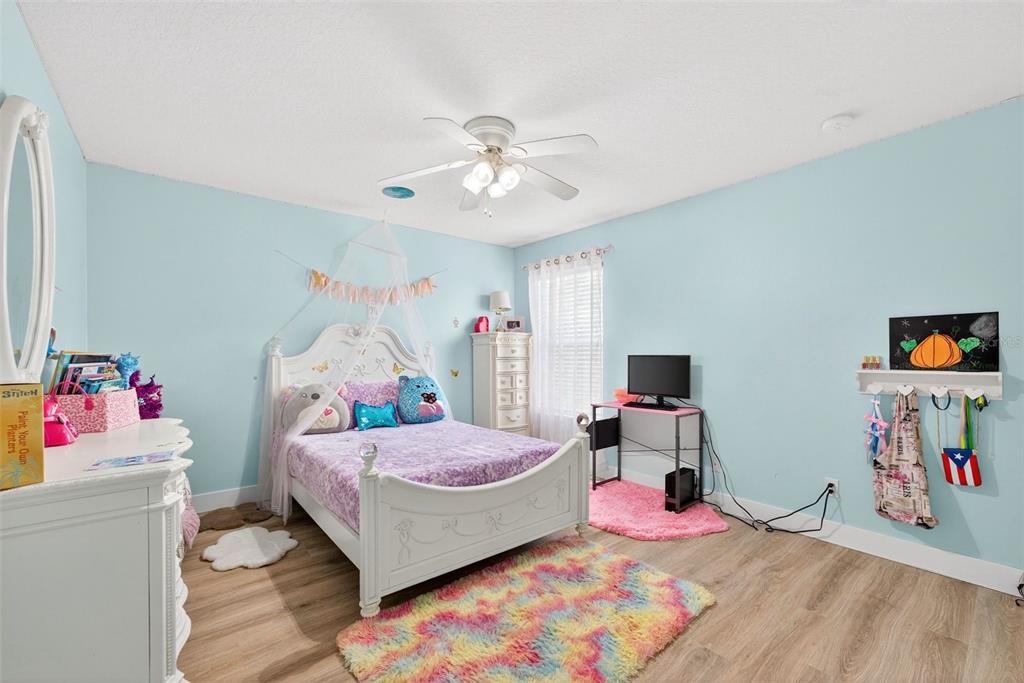 20930 Sullivan Ranch Boulevard Mount Dora, FL 32757 - Photo 31 of 41 a bedroom with a bed and a bed