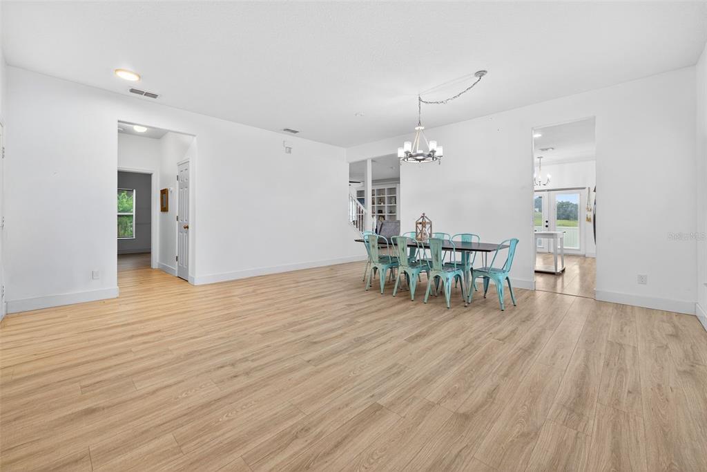 20930 Sullivan Ranch Boulevard Mount Dora, FL 32757 - Photo 5 of 41 a dining room with furniture and wooden floor