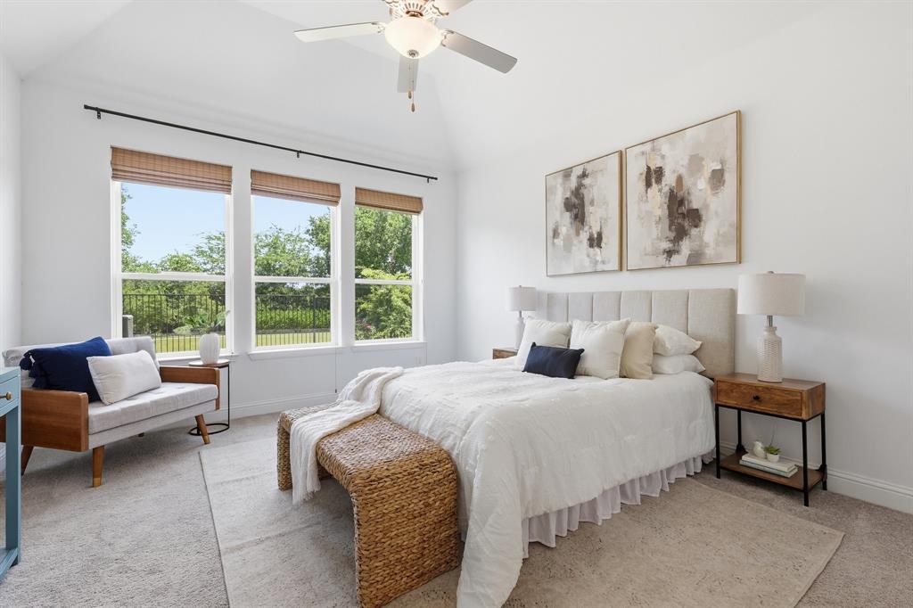 539 Farrell Lane Allen, TX 75013 - Photo 16 of 39 Vaulted ceiling featuring a ceiling fan, three large windows with natural wood blinds, plush carpet flooring, and a neutral color palette