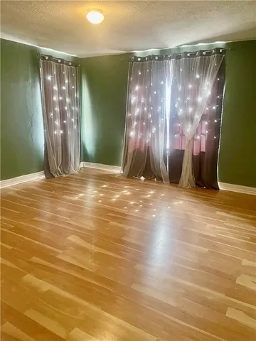 a view of a livingroom with wooden floor
