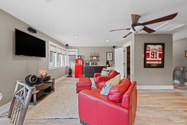 a kitchen with stainless steel appliances kitchen island granite countertop a refrigerator and a sink