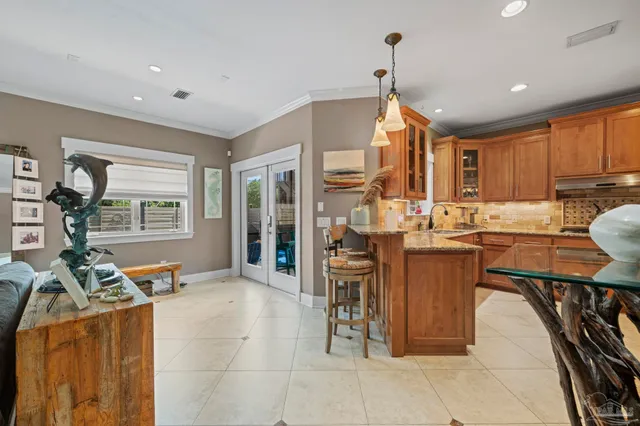 a kitchen with stainless steel appliances granite countertop a refrigerator and a stove