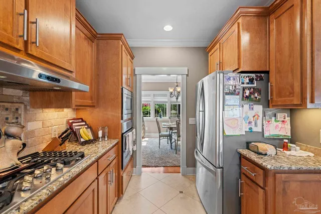 a workspace with furniture and a large window