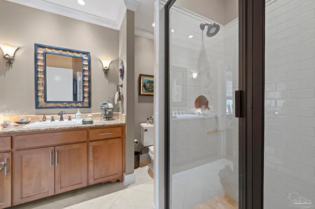 a view of a hallway with wooden floor and a living room