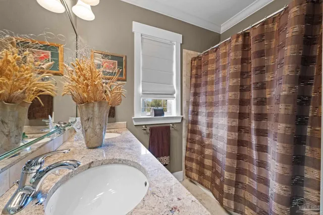 a bedroom with a large bed and a flat screen tv