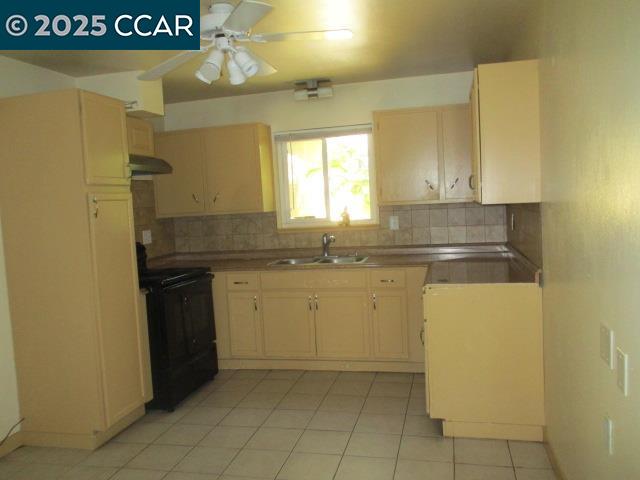 207 Thomas Way Pittsburg, CA 94565 - Photo 7 of 26 a kitchen with a sink a stove top oven and cabinets