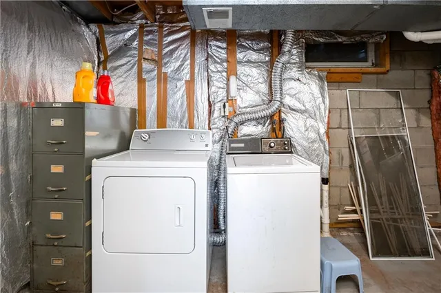 a view of storage and utility room with washer and dryer