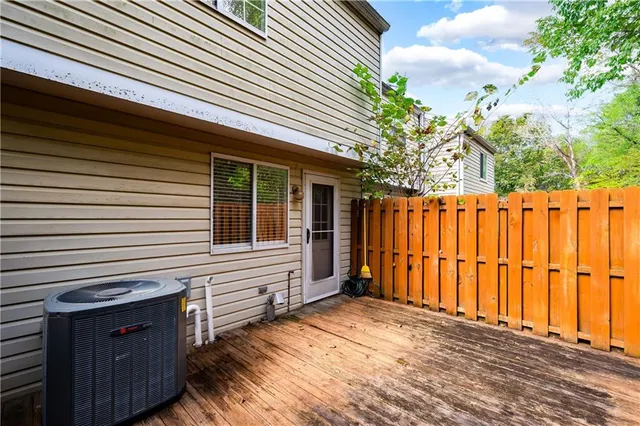 a view of a backyard with wooden fence