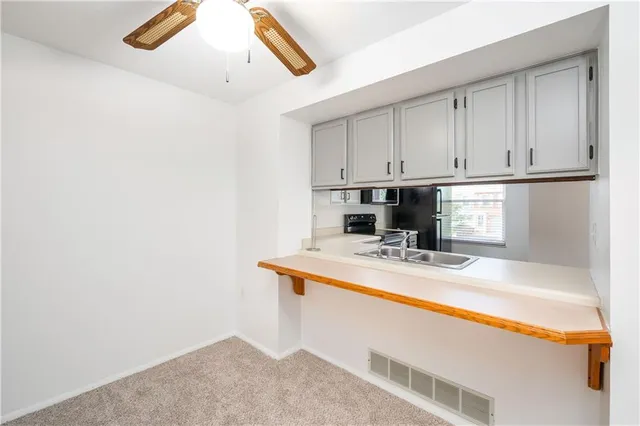 a view of a kitchen with a sink