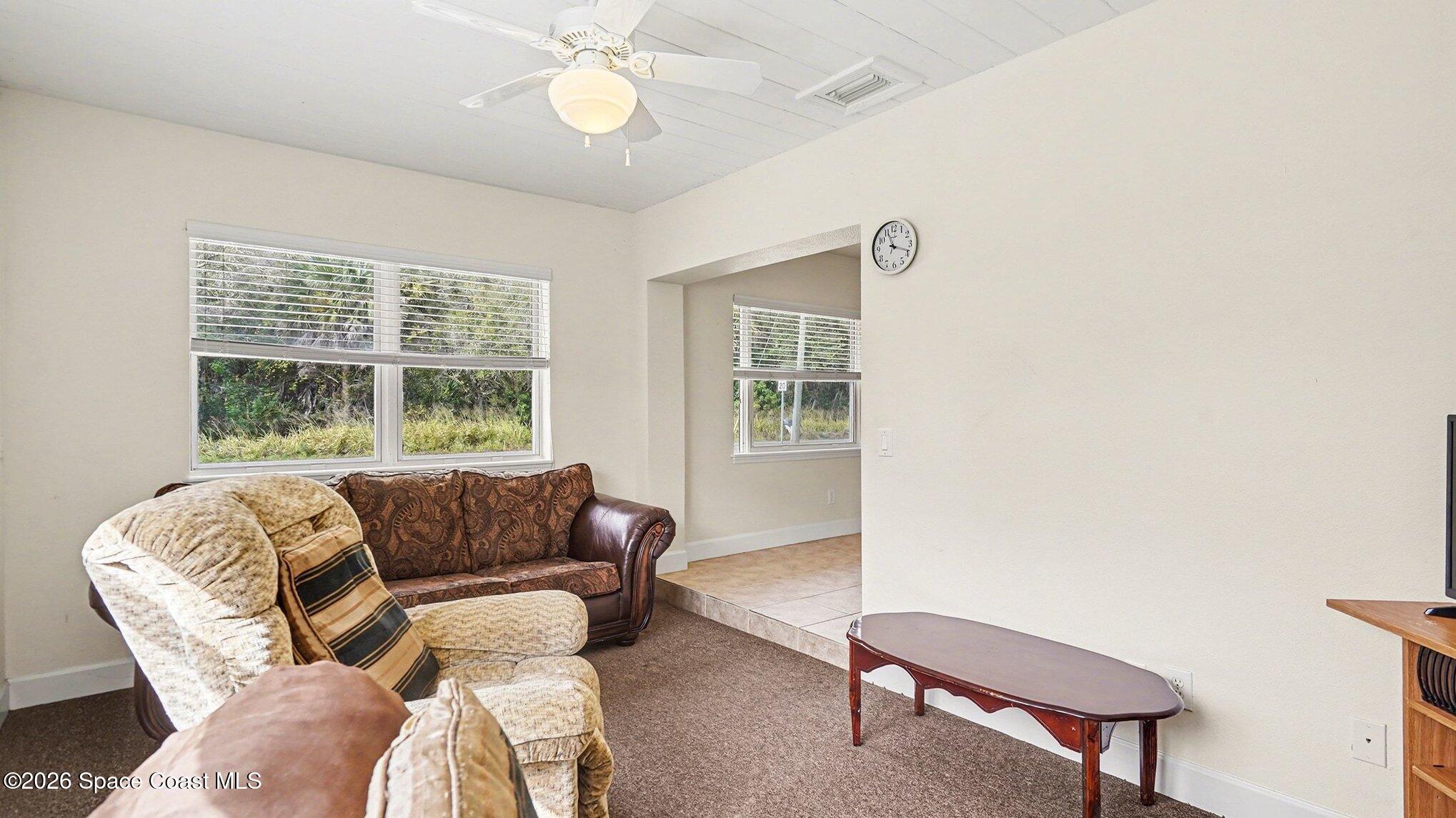136 Gray Road Melbourne, FL 32904 - Photo 11 of 27 a living room with furniture and a window