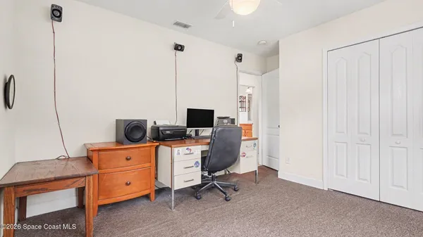 a view of a workspace with furniture