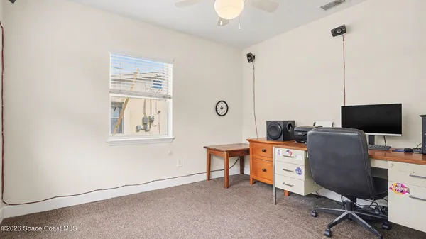 a view of a workspace with furniture