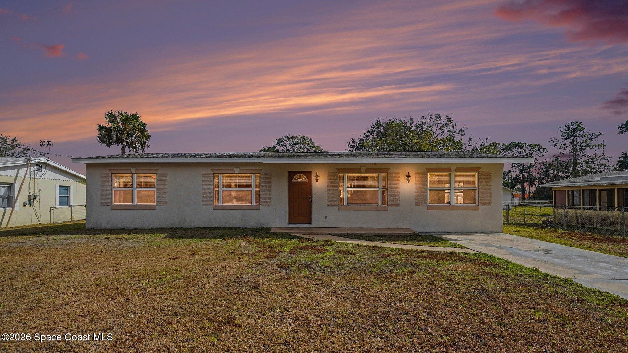 136 Gray Road Melbourne, FL 32904 - Photo 2 of 27 a front view of house with yard