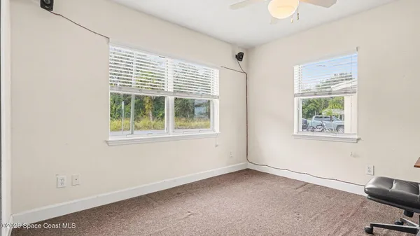 a view of an empty room with a window