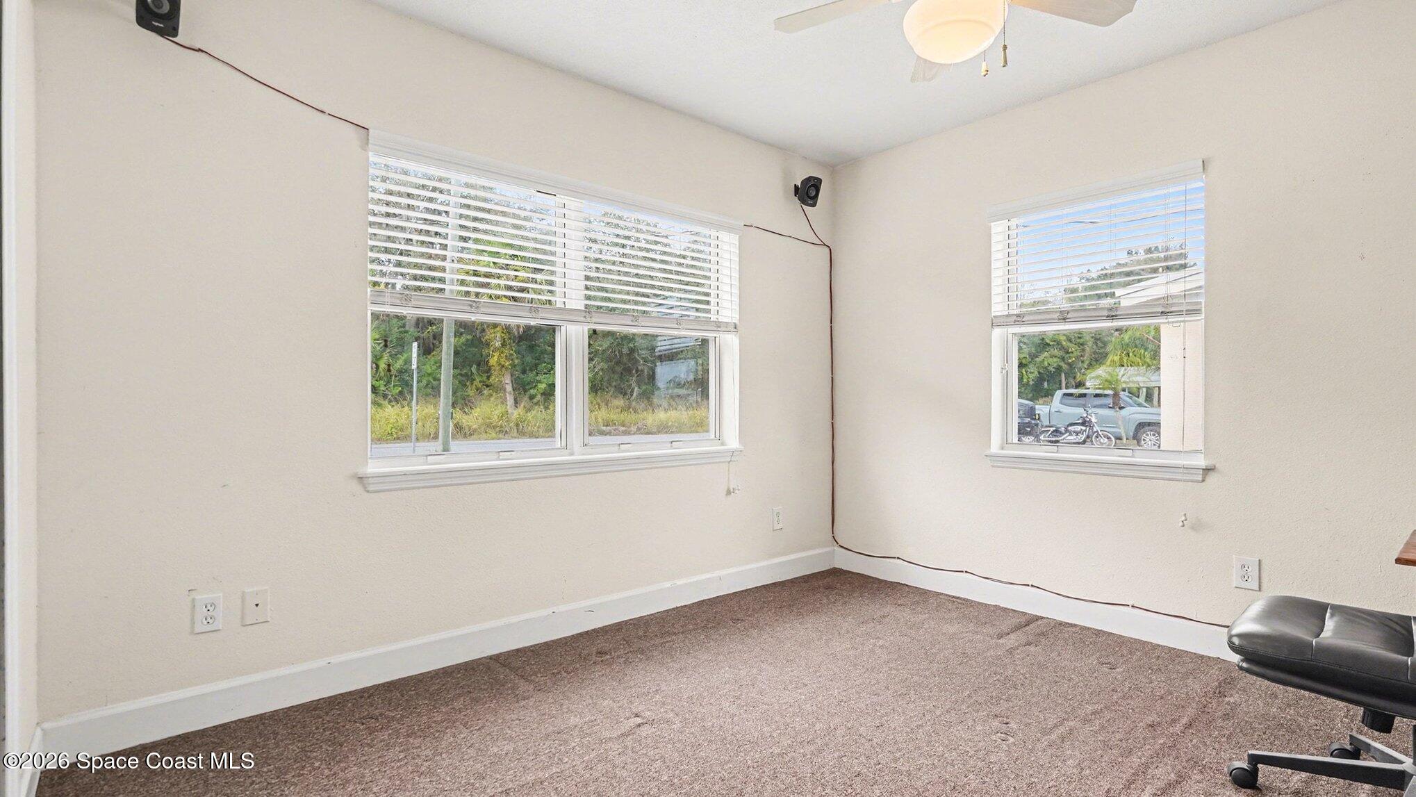 136 Gray Road Melbourne, FL 32904 - Photo 21 of 27 a view of an empty room with a window