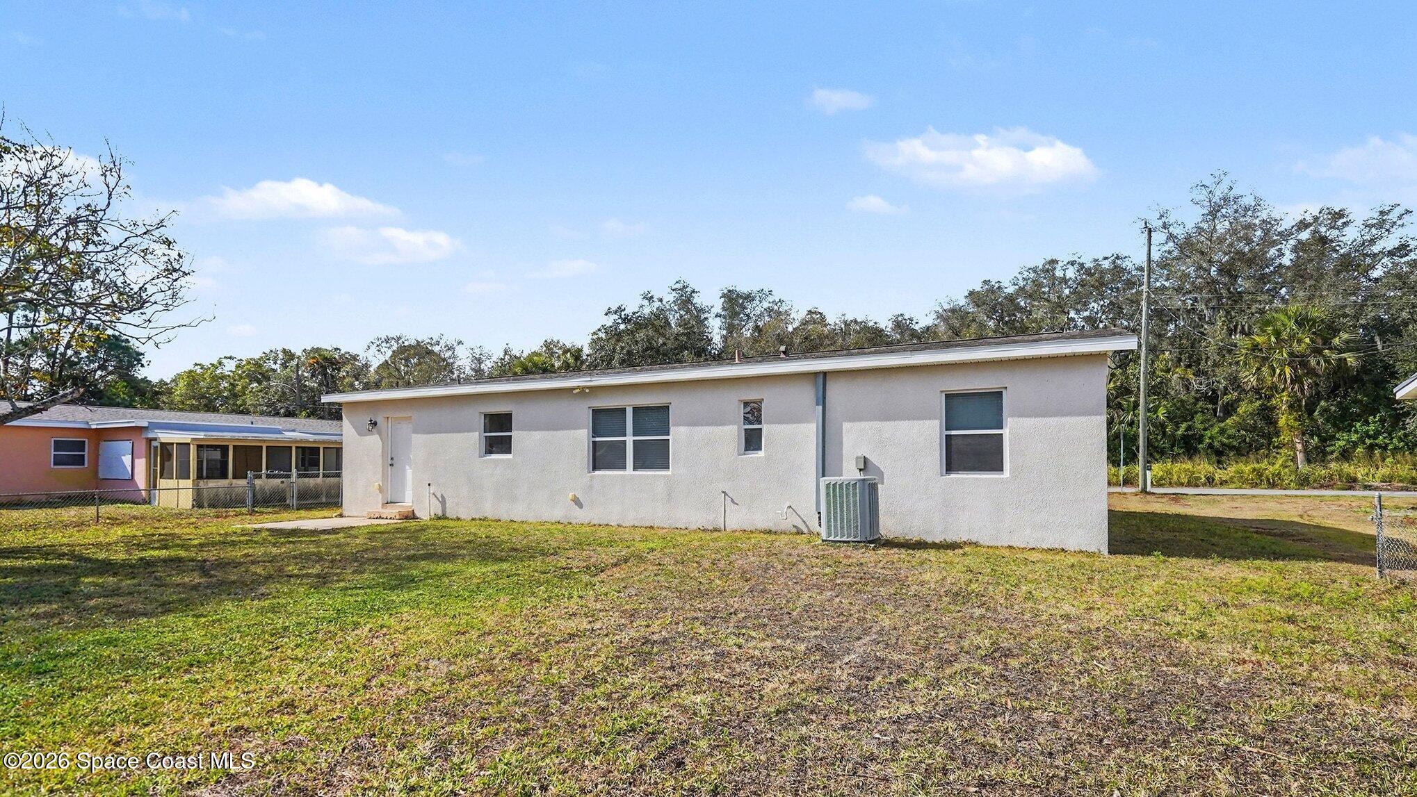 136 Gray Road Melbourne, FL 32904 - Photo 25 of 27 a house view with a garden space
