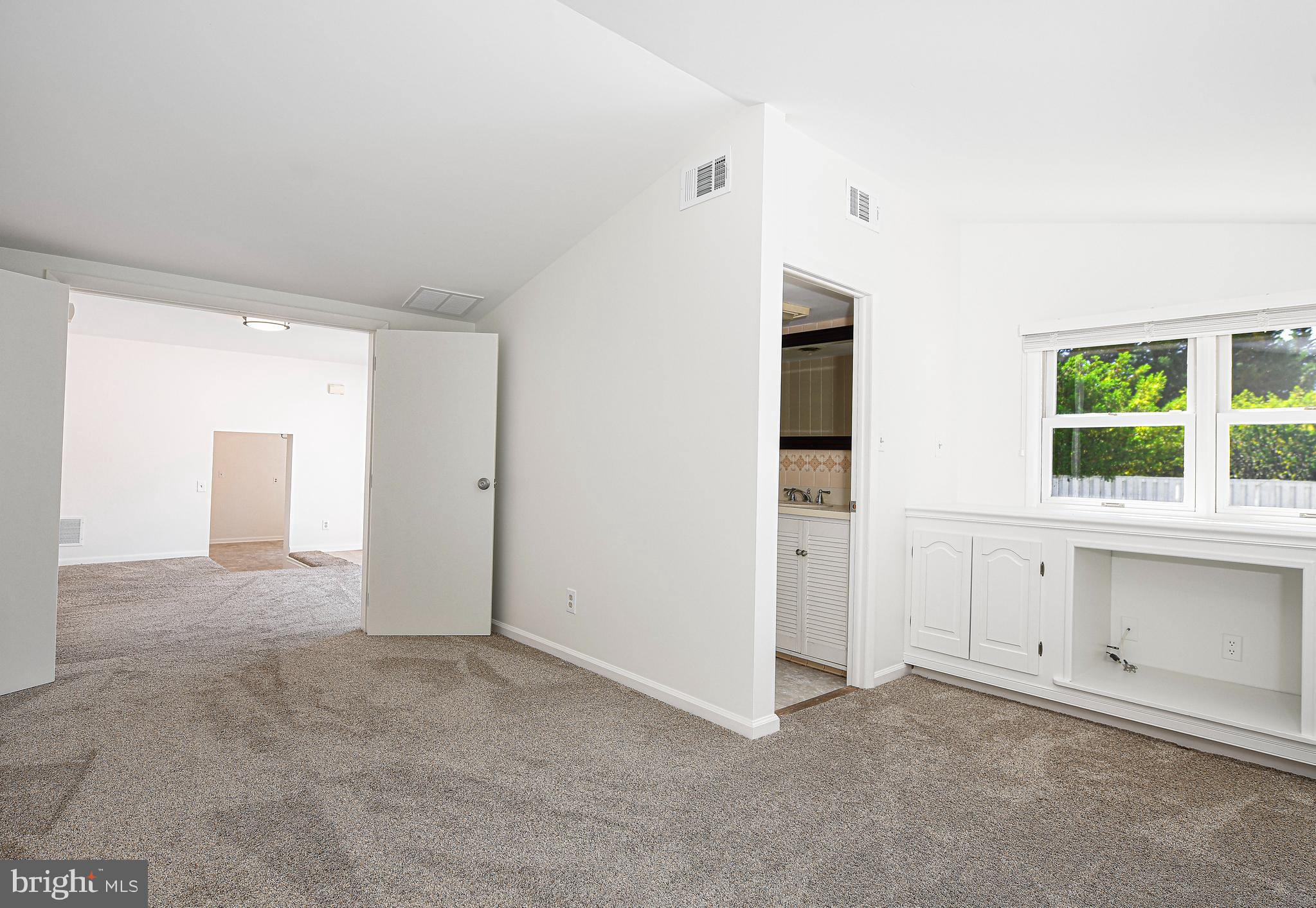 8724 Littlewood Road Baltimore, MD 21234 - Photo 9 of 30 Primary bedroom has a vaulted ceiling
