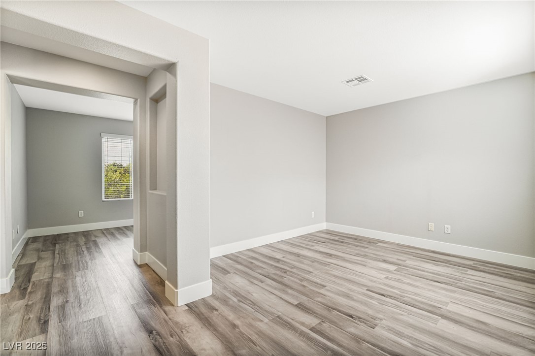 1533 Sabatini Drive Henderson, NV 89052 - Photo 17 of 27 Unfurnished room featuring light wood-style flooring and baseboards