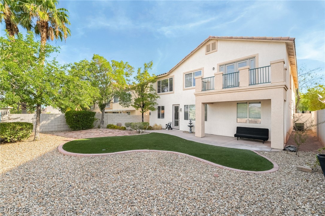 1533 Sabatini Drive Henderson, NV 89052 - Photo 26 of 27 Rear view of property with a balcony, stucco siding, a patio, and a fenced backyard