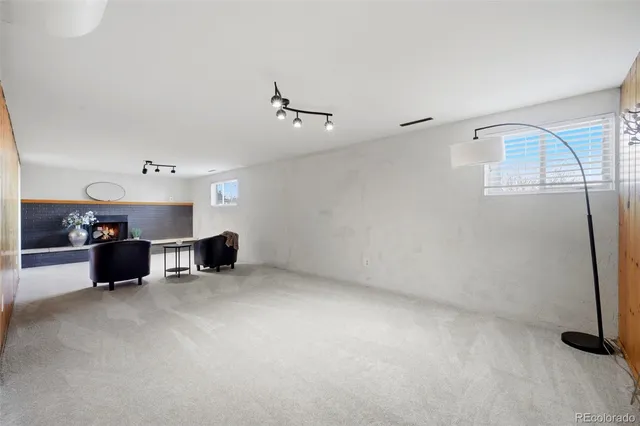 a view of kitchen with furniture and a ceiling fan