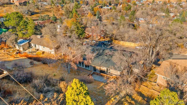 a view of a tree in front of a house