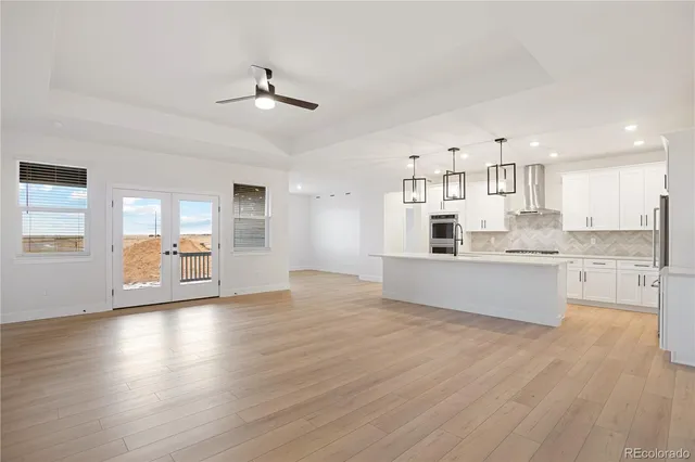 a view of a house with snow on the road