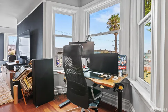 a workspace with furniture and window