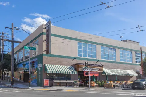 a view of a door and a chair and table in the balcony