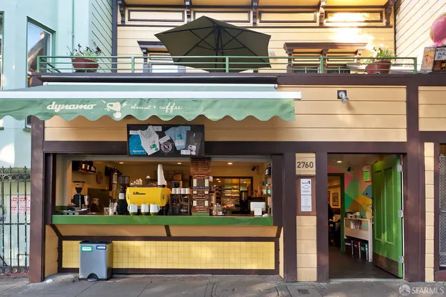 a front view of a building with a lot of windows