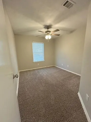 a bathroom with a double vanity sink toilet and mirror
