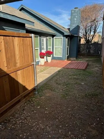 a view of a entryway door front of a house