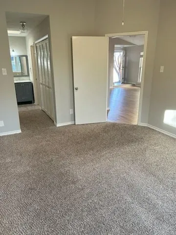 a view of kitchen with granite countertop cabinets and sink