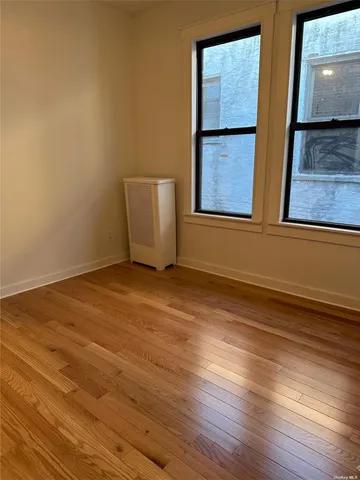 a kitchen with granite countertop a refrigerator and a stove top oven