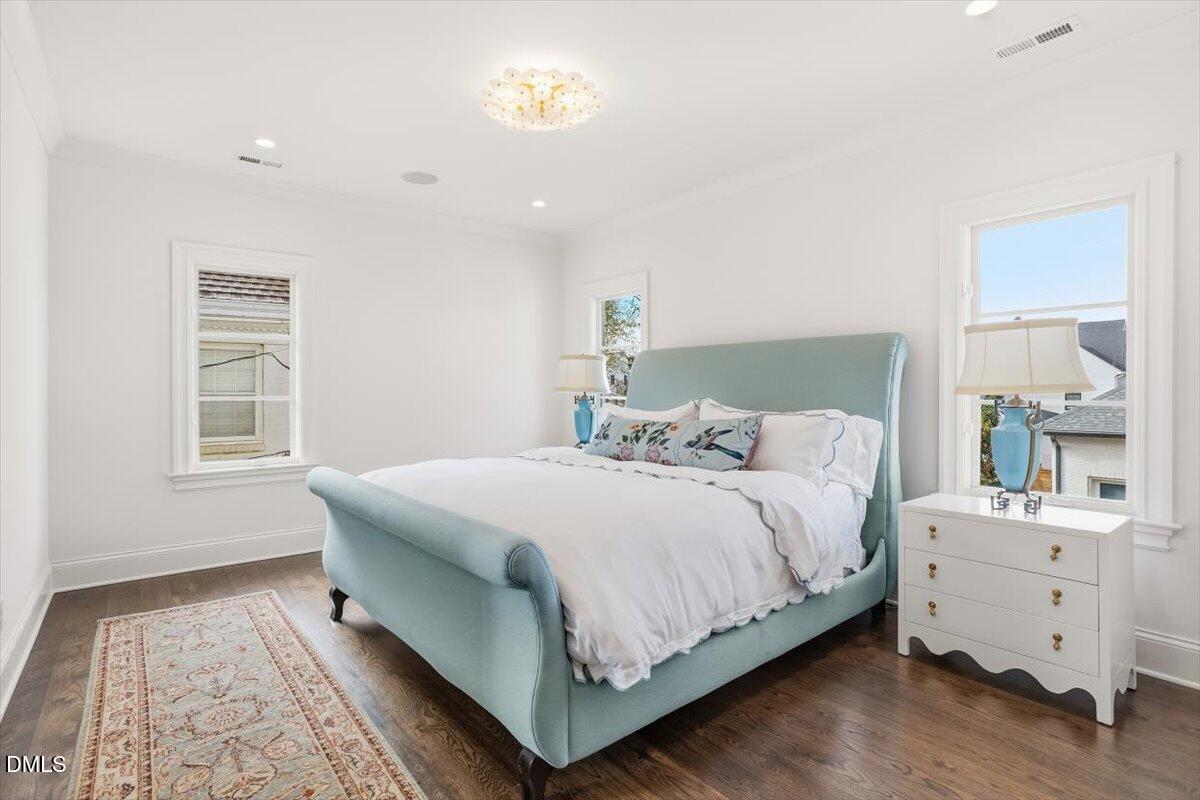 2123 St Marys Street Raleigh, NC 27608 - Photo 50 of 77 a bedroom with a bed and a window