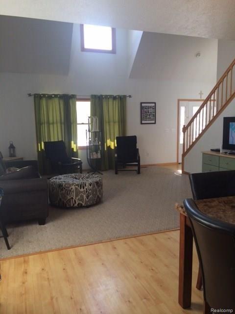 2835 Catholic Church Road Stockbridge, MI 49285 - Photo 10 of 11 living room/dining room with vaulted ceiling
