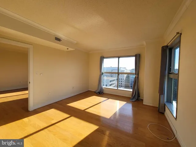a view of an empty room and a window