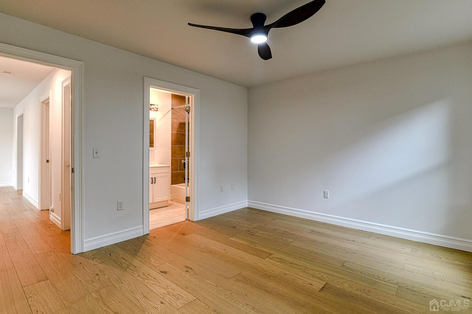 9 Altamont Road Edison, NJ 08817 - Photo 54 of 74 an empty room with wooden floor and windows