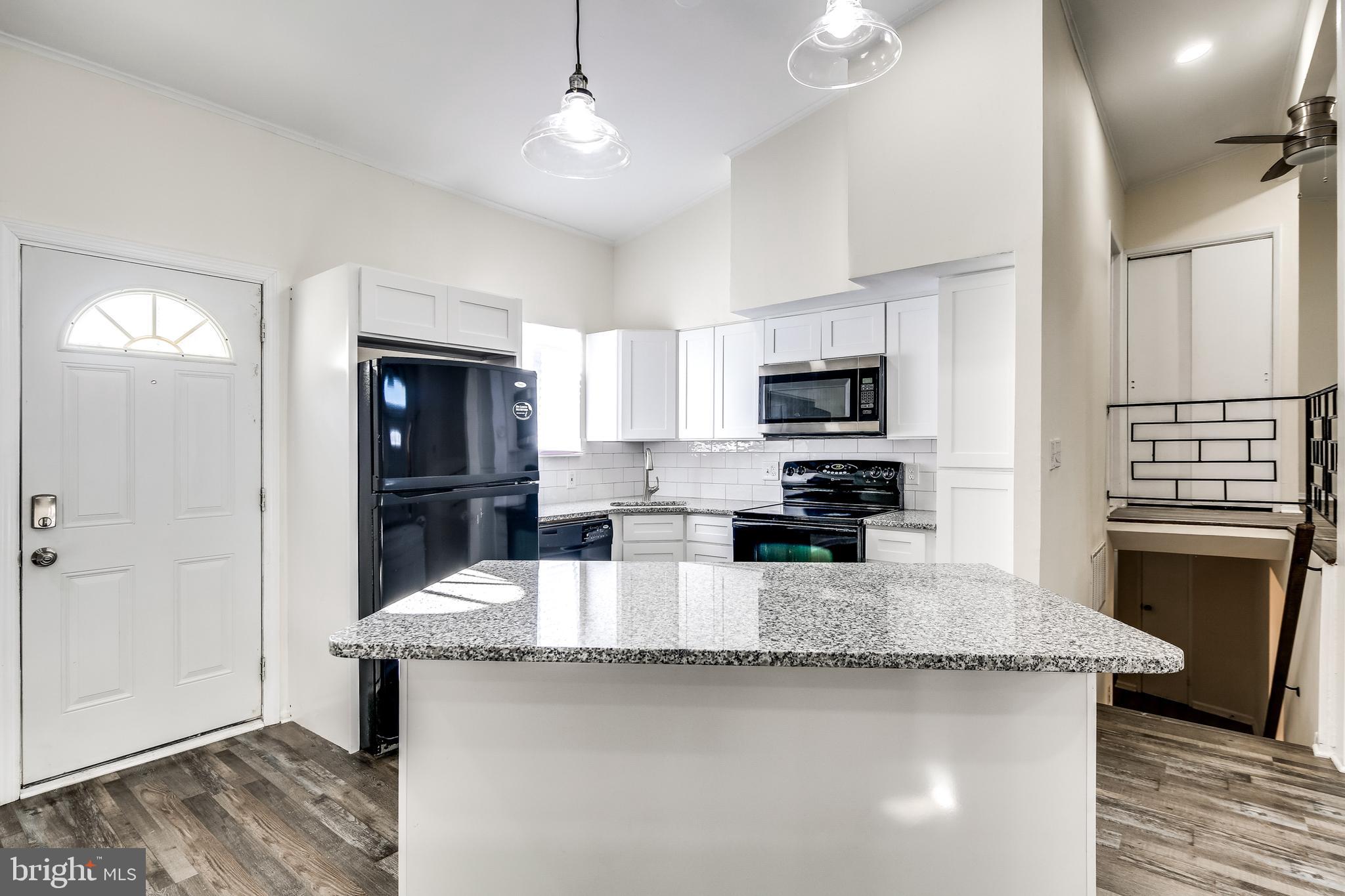 4727 Three Oaks Road Pikesville, MD 21208 - Photo 6 of 33 Island kitchen