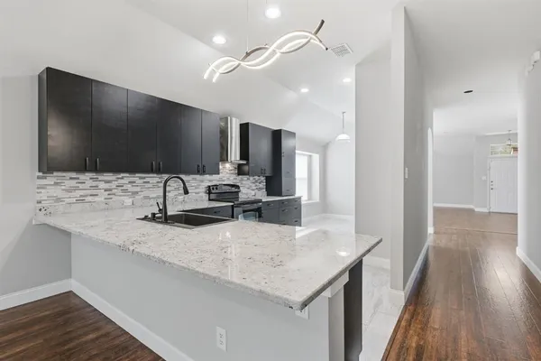 a bathroom with a sink a vanity and a mirror